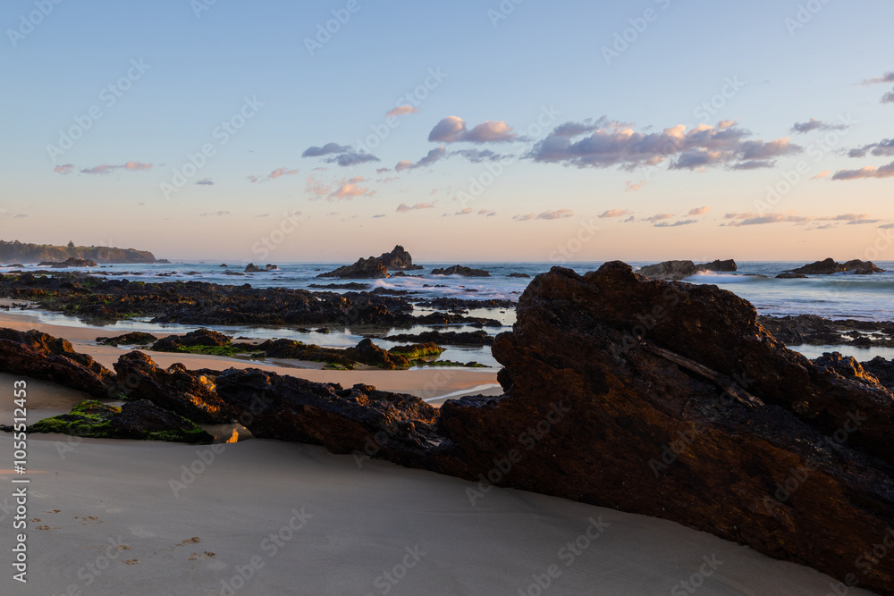 Fototapeta premium Rocky shore view of Narooma beach in the morning, NSW, Australia.