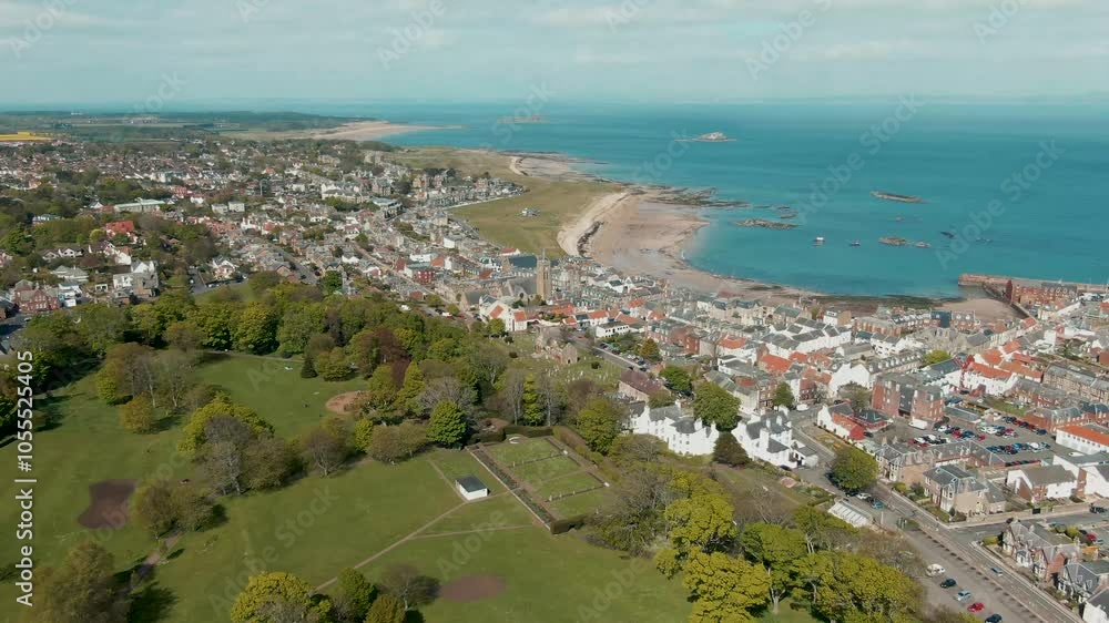 Aerial view of beautiful coastal town with park and beach along the sea, North Berwick, United Kingdom. Aerial view of beautiful coastal town with park and beach along the sea, North Berwick, United Kingdom.