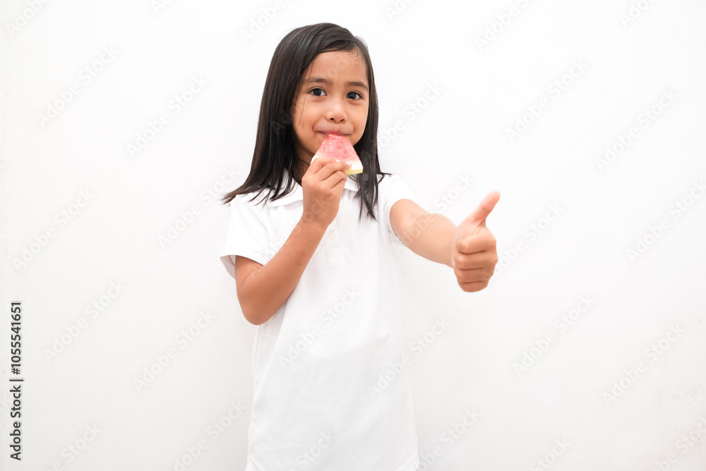 Cute little Asian girl enjoying watermelon isolated on white background Cute little Asian girl enjoying watermelon isolated on white background