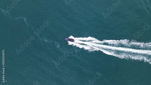 Wallpaper Mural Aerial view of a beautiful boat on the serene ocean with tranquil waves, Hong Kong. Torontodigital.ca