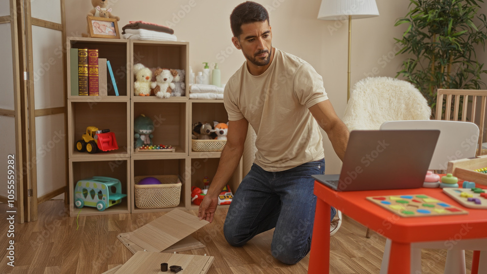Hispanic man assembling furniture in child's room while watching laptop, surrounded by toys and books, creating a cozy and organized home space. Hispanic man assembling furniture in child's room while watching laptop, surrounded by toys and books, creating a cozy and organized home space.