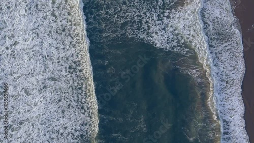 Aerial view of beautiful ocean waves and serene shore at Huntington Beach, California, United States of America. photo