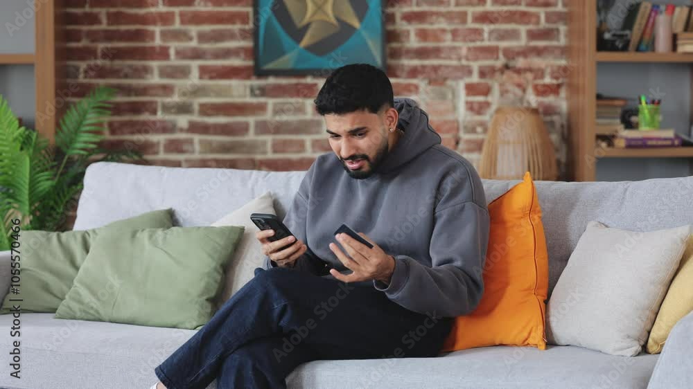 Confused man getting nervous while experiencing failure with using banking application in modern phone. Irritated consumer throwing away credit card while running out of budget during online shopping. Confused man getting nervous while experiencing failure with using banking application in modern phone. Irritated consumer throwing away credit card while running out of budget during online shopping.