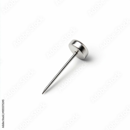 Close-Up of a Metal Push Pin on White Background