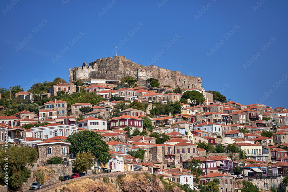 Historic houses and castle on top of a hill in Molyvos on the island of Lesbos, Greece Historic houses and castle on top of a hill in Molyvos on the island of Lesbos, Greece