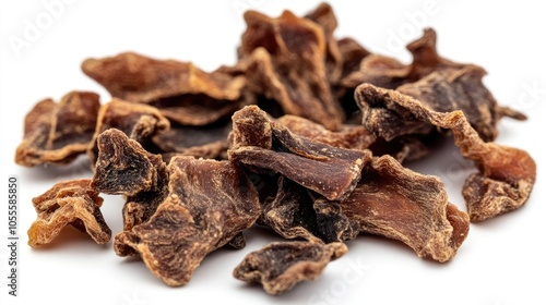 Dried beef lung bits a chewable and nearly fat free natural treat for dogs set against a white backdrop