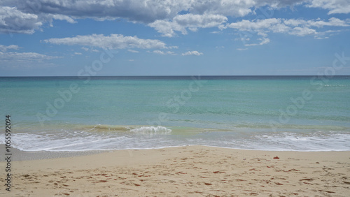 Beautiful beach scene in pescoluse, salento, with clear blue waters and serene skies at puglia, italy, showcasing the pristine coastline and tranquil sea.