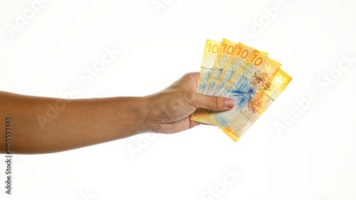 Hand holding swiss francs isolated on white background showing four 10 franc notes. photo