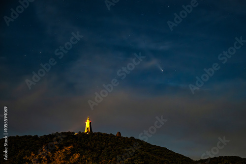 A view of the Kyffhaeuser at night in the sky a comet