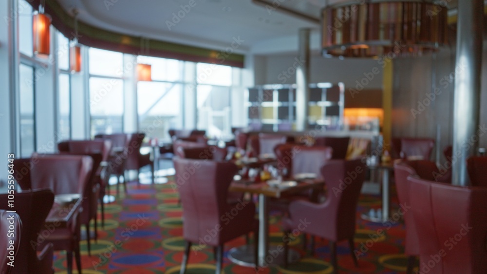Blurred luxury restaurant interior with elegant red chairs, vibrant decor, and soft lighting conveying a sophisticated atmosphere. Blurred luxury restaurant interior with elegant red chairs, vibrant decor, and soft lighting conveying a sophisticated atmosphere.
