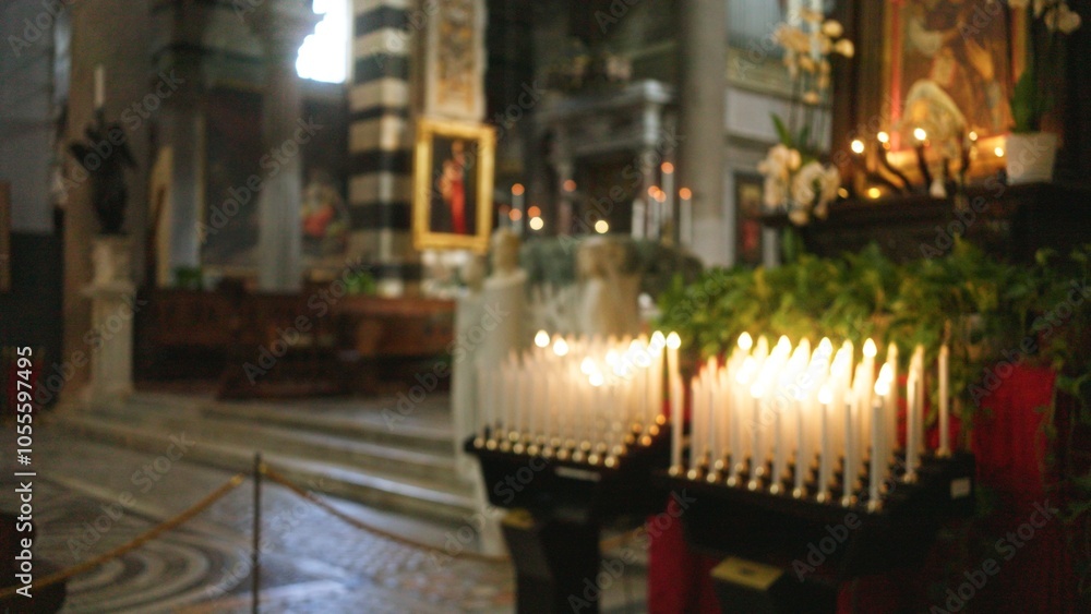 Blurry image of church interior with lit candles creating a bokeh effect, highlighting religious ambiance with artwork and candles in a serene atmosphere. Blurry image of church interior with lit candles creating a bokeh effect, highlighting religious ambiance with artwork and candles in a serene atmosphere.