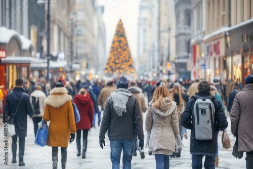 A bustling city street is filled with joyful pedestrians walking amidst snow dusted buildings. Twinkling holiday lights and a towering Christmas tree create a vibrant atmosphere of celebration during 