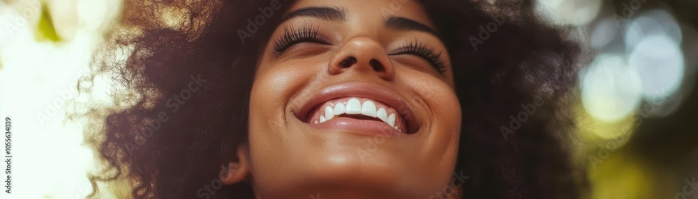 Fototapeta premium Close-up of young woman with joyful smile, flawless teeth, warmth and sincerity