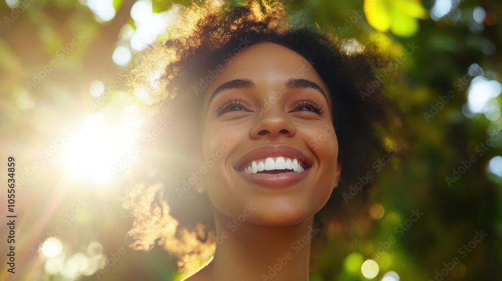 Joyful woman with perfect white teeth, gentle smile, sunlight filtering through trees Joyful woman with perfect white teeth, gentle smile, sunlight filtering through trees