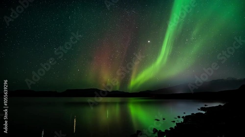 Wallpaper Mural Aerial view of northern lights illuminating a serene landscape with water and stars, Krysuvik, Iceland. Torontodigital.ca