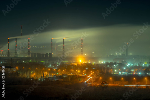 The night view of Novokuznetsk aluminium factory, with smoky chimneys and industrial facility, at Kemerovo Oblast, Russia.
 photo