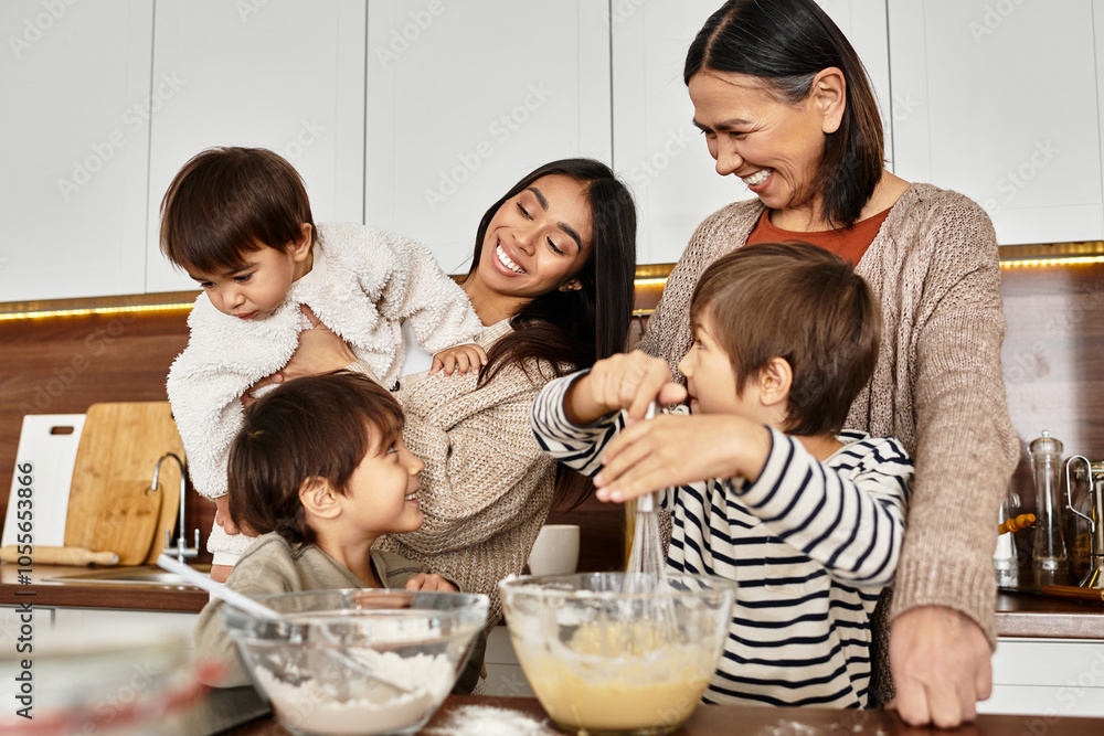 A happy family enjoys the warmth of cooking together, creating festive treats for Christmas with children engaged. A happy family enjoys the warmth of cooking together, creating festive treats for Christmas with children engaged.