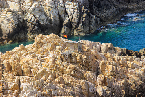 Bamboo huts with thatched roofs on the rocky islands in Nha Trang Bay, home to those who protect and harvest bird's nests - a most nutritious dish for human health - Khanh Hoa specialty photo