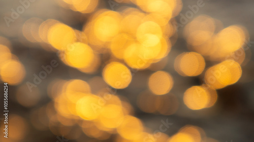 Abstract background. Blurred bokeh. Golden yellow bokeh.