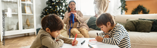 A cheerful family gathers around the Christmas tree, enjoying quality time while kids create festive art.