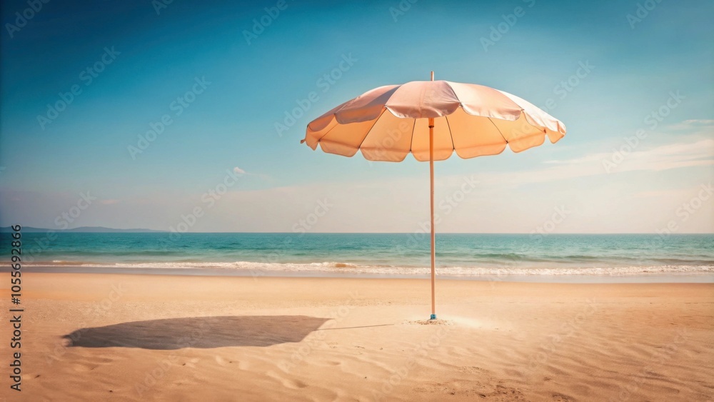Pastel peach color beach umbrella standing in the sand, summer, vacation, seaside, leisure, relaxation, tranquil, resort Pastel peach color beach umbrella standing in the sand, summer, vacation, seaside, leisure, relaxation, tranquil, resort