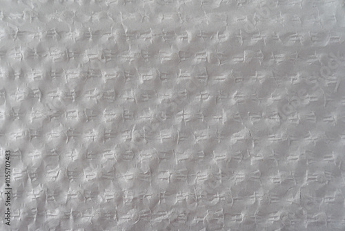 Recycled perforated white paper close up texture. Old paper background.