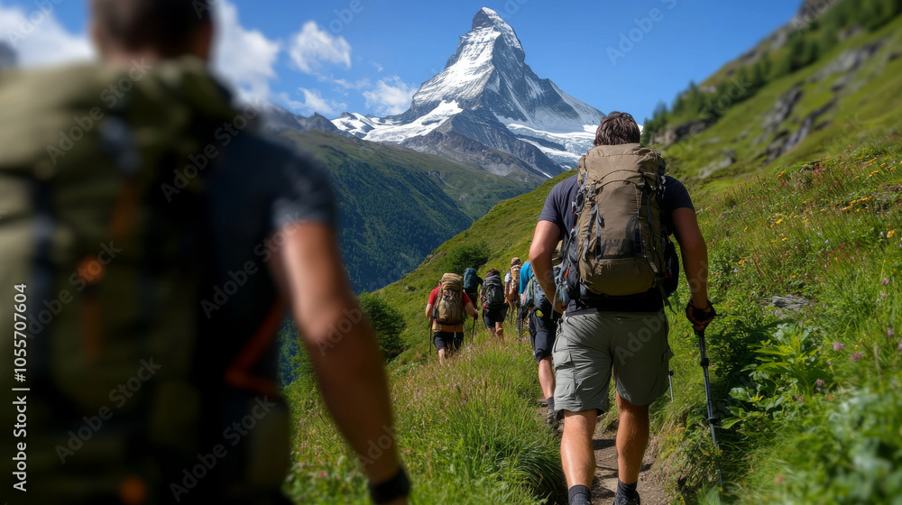 A group of hikers trekking along a mountain trail in Zermatt, with the Matterhorn looming in the background. A group of hikers trekking along a mountain trail in Zermatt, with the Matterhorn looming in the background.