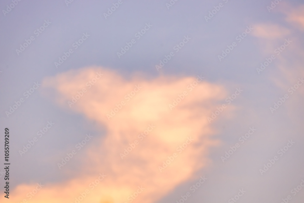 A beautiful sky tinted by the sun leaving vibrant shades of gold, pink, blue and multicolored. Clouds in the twilight evening and morning sky. Cloudy sky background in the evening, and during the day. A beautiful sky tinted by the sun leaving vibrant shades of gold, pink, blue and multicolored. Clouds in the twilight evening and morning sky. Cloudy sky background in the evening, and during the day.