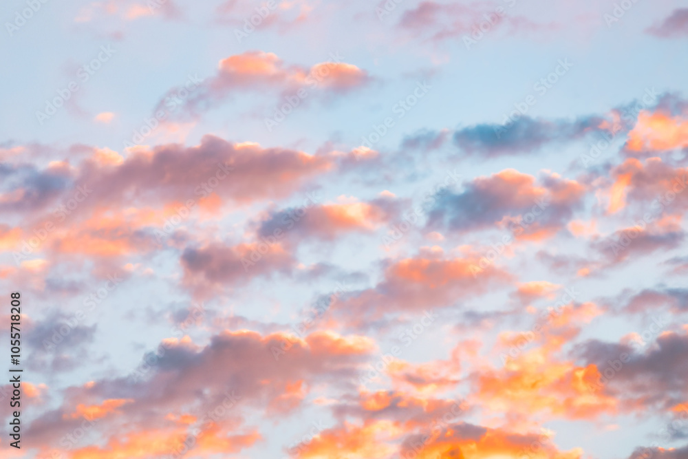 A beautiful sky tinted by the sun leaving vibrant shades of gold, pink, blue and multicolored. Clouds in the twilight evening and morning sky. Cloudy sky background in the evening, and during the day. A beautiful sky tinted by the sun leaving vibrant shades of gold, pink, blue and multicolored. Clouds in the twilight evening and morning sky. Cloudy sky background in the evening, and during the day.