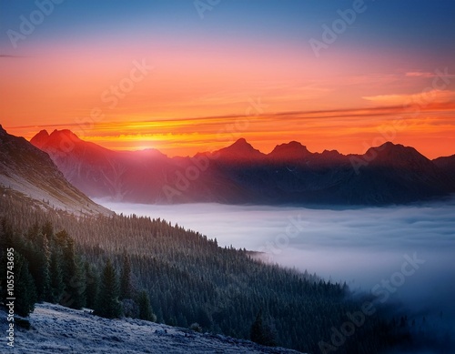 Colorful winter sunrise in the foggy mountains