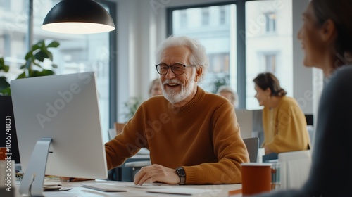 Senior man enjoying productive teamwork in a modern office environment during the day