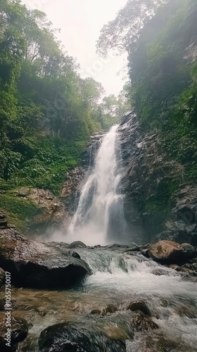 Cascading Waterfall Flowing Down Rocky Cliff