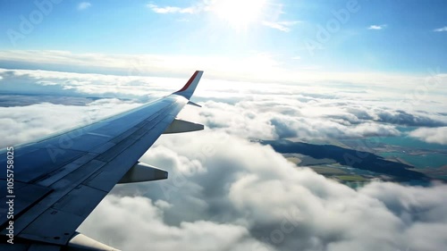plane flying view wing clouds sky aeroplane cloud fly travel blue aircraft air flight jet high transportation horizon earth up window white transport aerial aviation vacation tour tourism speed