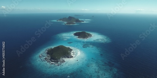 Aerial view of several small islands in the ocean.