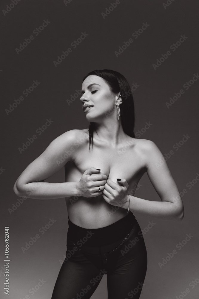 Stylish, luxurious photo shoot of a beautiful girl in a jacket and without in a photo studio in fashion and Vogue style. Stylish, luxurious photo shoot of a beautiful girl in a jacket and without in a photo studio in fashion and Vogue style.