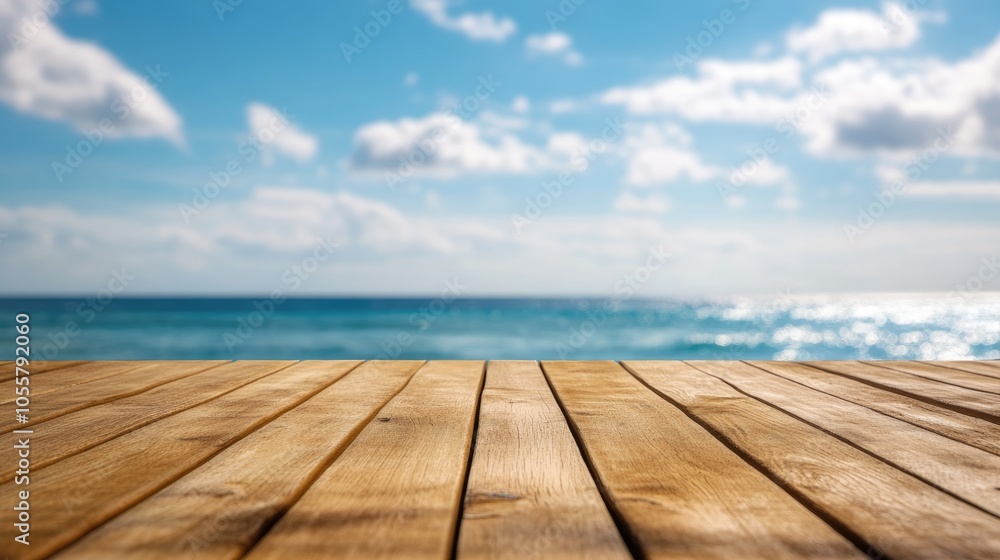 Wooden deck table surface with a blurred sea and blue sky backdrop ideal for showcasing or presenting products High quality image Wooden deck table surface with a blurred sea and blue sky backdrop ideal for showcasing or presenting products High quality image