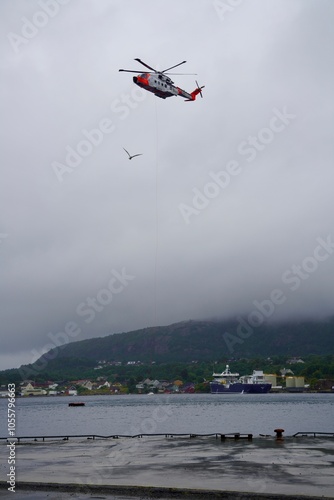 An AW101 helicopter of the Royal Norwegian Airforce hovers during a rescue exercise in  Norway photo