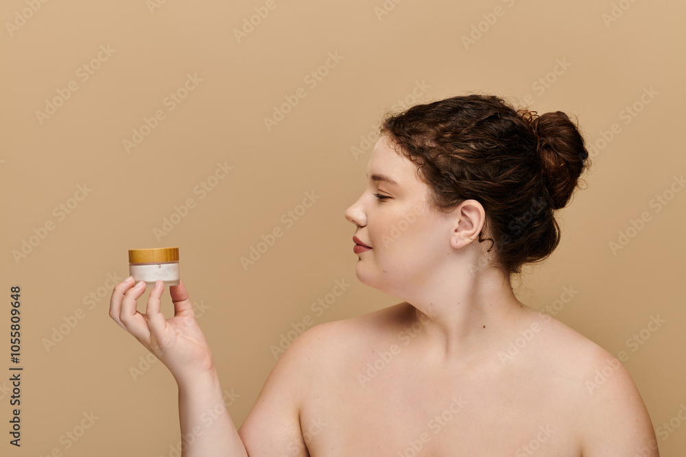 A graceful plus size woman admires a skincare product in a soothing color palette. A graceful plus size woman admires a skincare product in a soothing color palette.