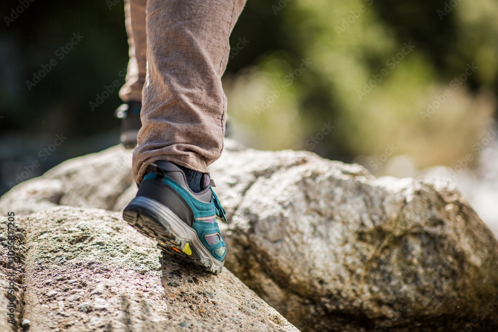Close-up of hiking shoes on rocky terrain during an outdoor trek Close-up of hiking shoes on rocky terrain during an outdoor trek