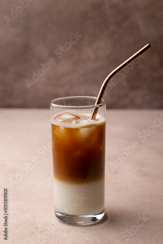 Wallpaper Mural Coffee with coconut milk and ice cubes in a tall glass. Traditional non-alcoholic cold drink. In the background, a jar of coffee and a jar of sugar. Selective focus, close-up. Torontodigital.ca