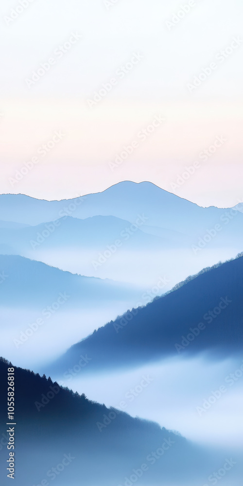 Obraz premium Serene morning mountains with misty valleys and soft blue hues