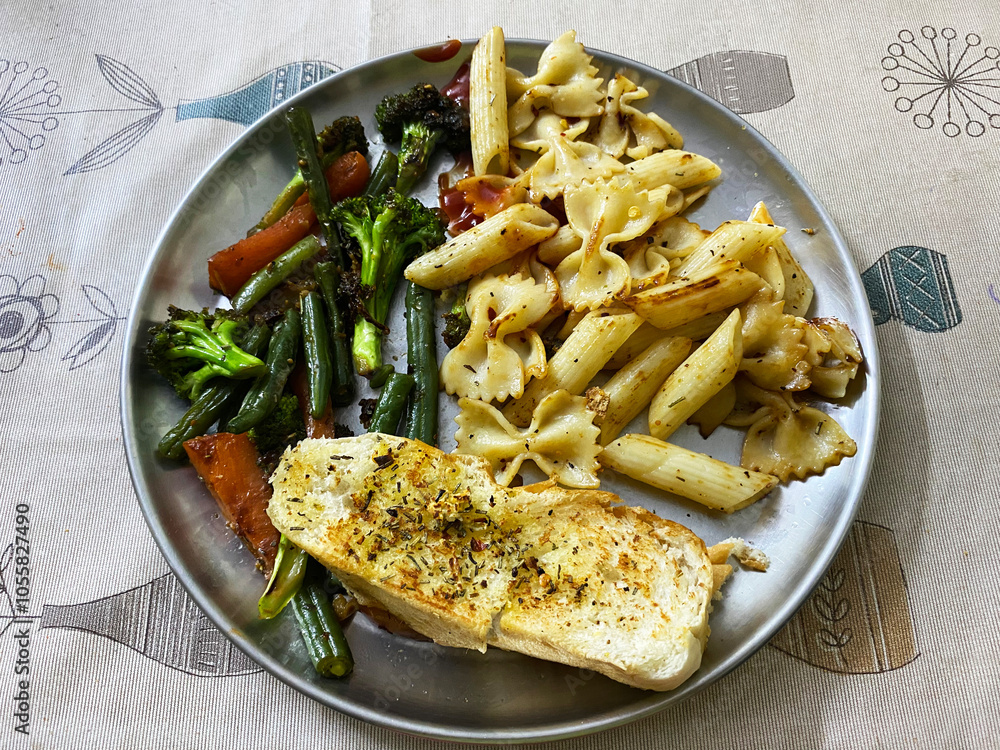 top view reveals a colorful plate of sautéed vegetables, their bright hues glistening beside slices of golden, crispy garlic top view reveals a colorful plate of sautéed vegetables, their bright hues glistening beside slices of golden, crispy garlic