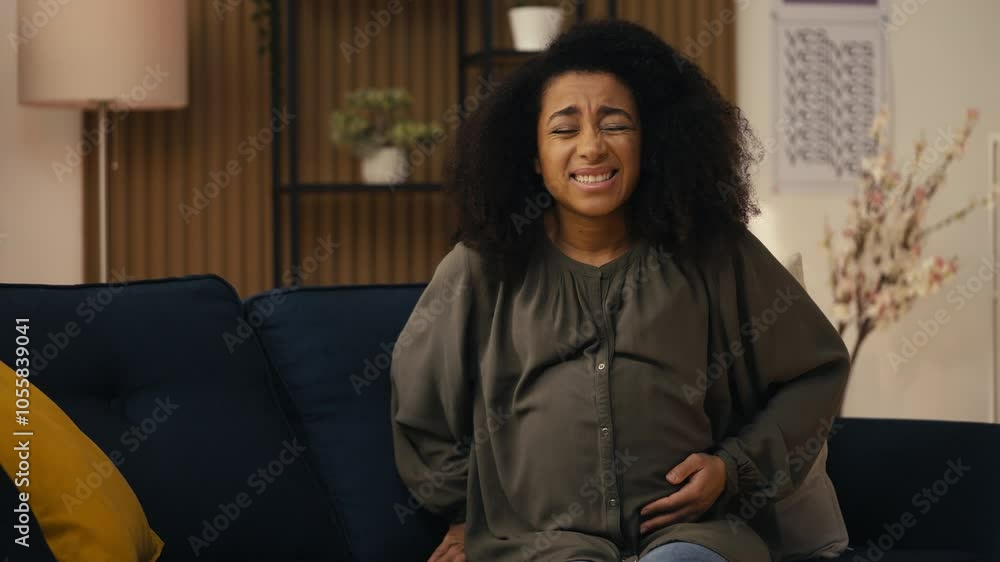 Young pregnant woman feeling sharp pain in belly, calling hospital, childbirth Young pregnant woman feeling sharp pain in belly, calling hospital, childbirth