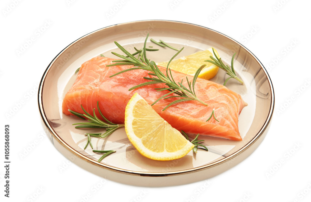 Red fish. Raw salmon fillet with rosemary and lemon on plate isolated on white background. Red fish. Raw salmon fillet with rosemary and lemon on plate isolated on white background.