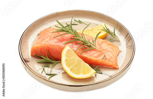 Red fish. Raw salmon fillet with rosemary and lemon on plate isolated on white background.