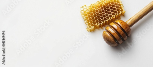 Raw Homey With Honeycomb And A Dipper Or Wooden Wand On A White Background With Copyspace For Medicinal And Food Concepts