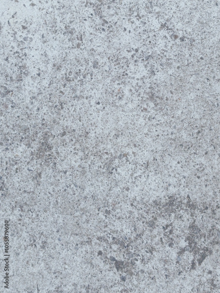 A grey and white wall with a few spots of color A grey and white wall with a few spots of color
