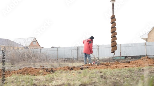 April 2020, Orenburg, Russia. Migrants engaged in seasonal construction work. Drilling water wells. Technique for water extraction.