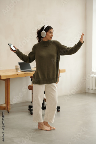 Enjoying Music While Dancing in Cozy Home Office
