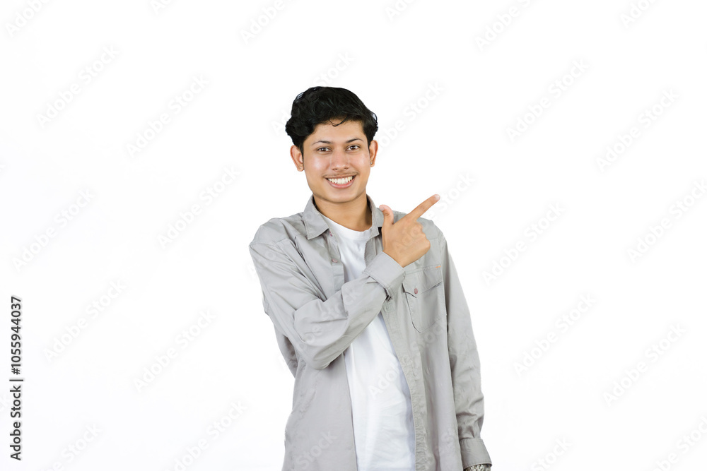 Young Teenager in shirt and vest gives expression of happiness and sadness points with gestures with hands Young Teenager in shirt and vest gives expression of happiness and sadness points with gestures with hands